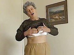 granny laying on the bed and masturbating